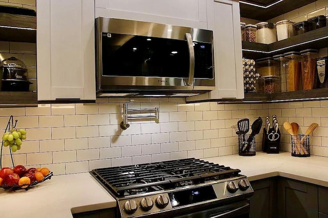 6 Devon Ct, Nanuet, NY 10954 - kitchen featuring appliances with stainless steel finishes, light countertops, tasteful backsplash, and white cabinets
