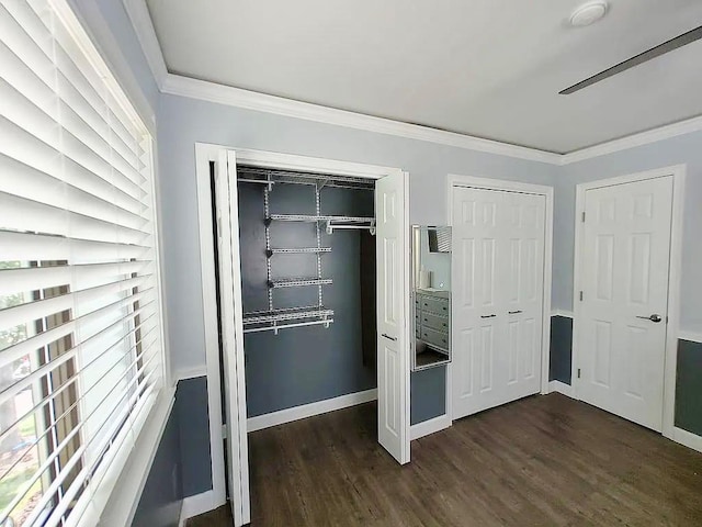 6 Devon Ct, Nanuet, NY 10954 - unfurnished bedroom featuring multiple closets, dark wood-style floors, and ornamental molding
