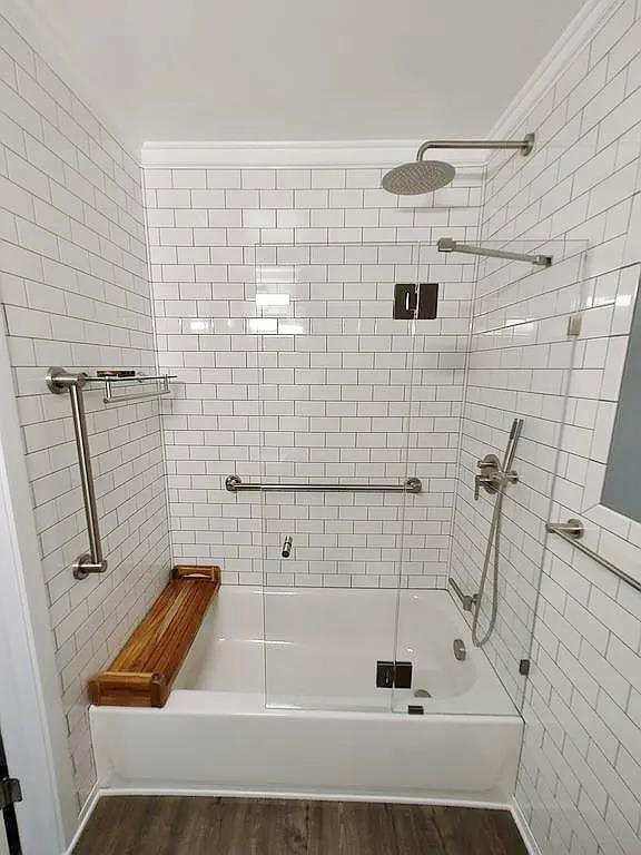 6 Devon Ct, Nanuet, NY 10954 - bathroom featuring enclosed tub / shower combo, wood finished floors, and tile walls