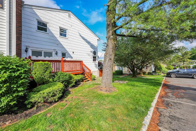 22 Sharon Dr, Spring Valley, NY 10977 - view of green lawn with a wooden deck