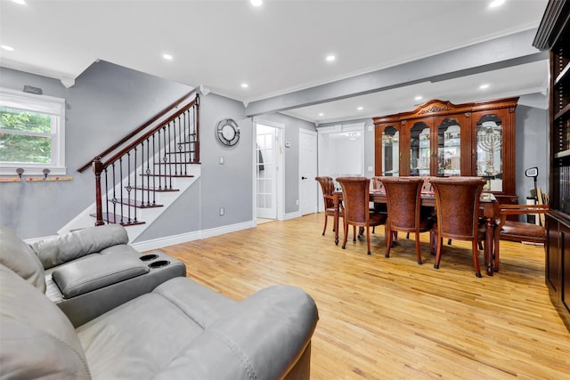 22 Sharon Dr, Spring Valley, NY 10977 - living room with light wood-type flooring, stairway, crown molding, recessed lighting, and a bar