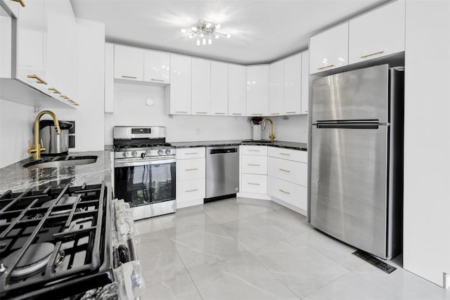 22 Sharon Dr, Spring Valley, NY 10977 - kitchen featuring appliances with stainless steel finishes, white cabinetry, and modern cabinets