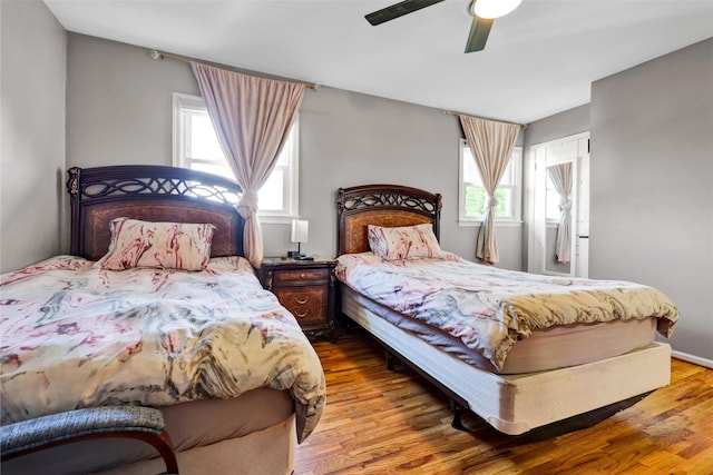 22 Sharon Dr, Spring Valley, NY 10977 - bedroom with multiple windows, wood finished floors, and a ceiling fan