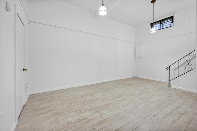22 Sharon Dr, Spring Valley, NY 10977 - basement featuring light wood finished floors and stairs