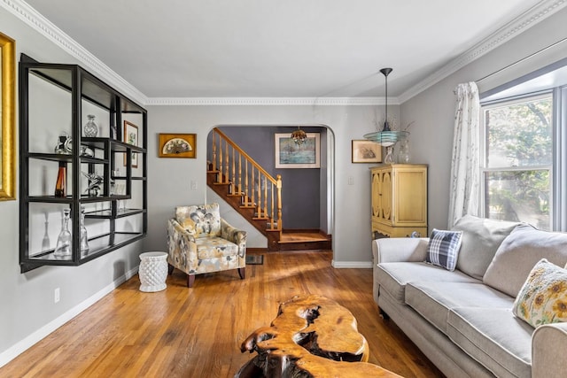 77 Nancy Blvd, Merrick, NY 11566 - living room featuring stairway, wood finished floors, arched walkways, and ornamental molding