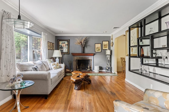 77 Nancy Blvd, Merrick, NY 11566 - living area featuring wood finished floors, a brick fireplace, and ornamental molding