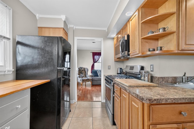 9 Grandview Ave, Middletown, NY 10940 - kitchen with appliances with stainless steel finishes, ornamental molding, light tile patterned floors, and open shelves