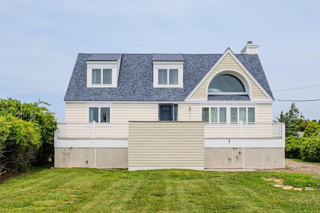 10 Bayview Rd, Remsenburg, NY 11960 - rear view of house with a yard, roof with shingles, a balcony, and a chimney