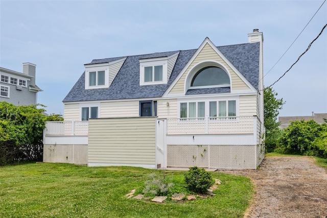10 Bayview Rd, Remsenburg, NY 11960 - rear view of house with a shingled roof and a yard
