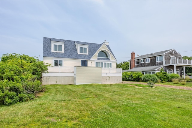 10 Bayview Rd, Remsenburg, NY 11960 - rear view of property with a lawn and roof with shingles