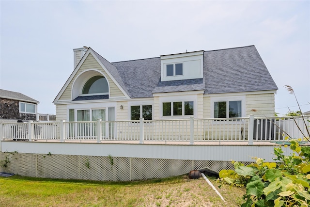 10 Bayview Rd, Remsenburg, NY 11960 - rear view of house featuring a shingled roof, a deck, and a chimney