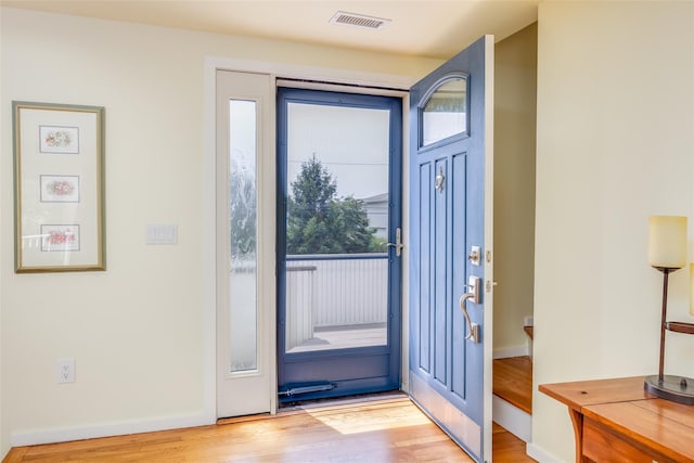 10 Bayview Rd, Remsenburg, NY 11960 - foyer entrance featuring plenty of natural light and light wood-type flooring