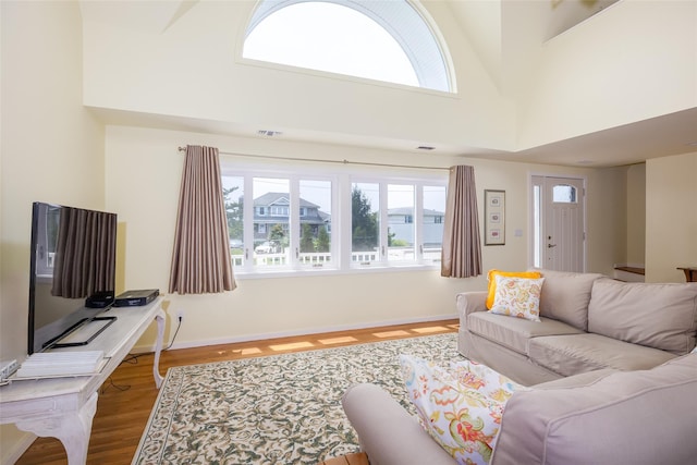 10 Bayview Rd, Remsenburg, NY 11960 - living room featuring wood finished floors and a high ceiling