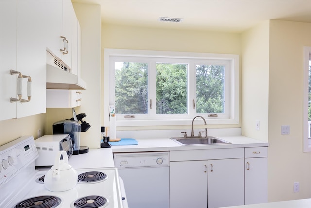 10 Bayview Rd, Remsenburg, NY 11960 - kitchen with white appliances, light countertops, white cabinets, and under cabinet range hood