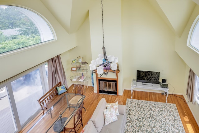 10 Bayview Rd, Remsenburg, NY 11960 - living room featuring a chandelier, high vaulted ceiling, and wood finished floors