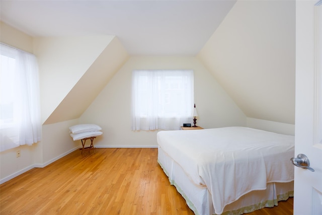 10 Bayview Rd, Remsenburg, NY 11960 - bedroom with lofted ceiling and light wood-type flooring