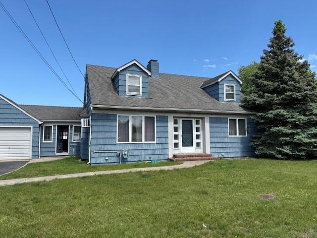 624 Adams Ave, Lindenhurst, NY 11757 - cape cod-style house with a chimney, a front yard, and an attached garage