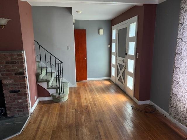 624 Adams Ave, Lindenhurst, NY 11757 - foyer entrance featuring wood-type flooring and stairway