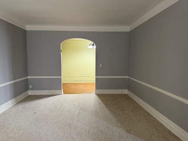 1 Meadow Dr Unit 3D, Woodmere, NY 11598 - spare room with arched walkways, ornamental molding, and carpet floors