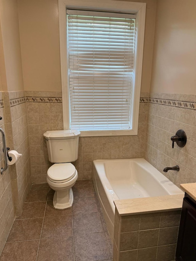 1 Meadow Dr Unit 3D, Woodmere, NY 11598 - full bath featuring tile walls, a garden tub, wainscoting, vanity, and tile patterned floors