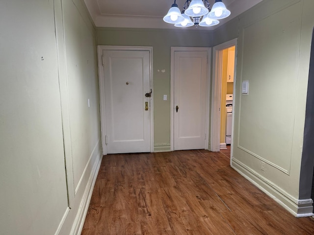 1 Meadow Dr Unit 3D, Woodmere, NY 11598 - hall with a chandelier and wood finished floors