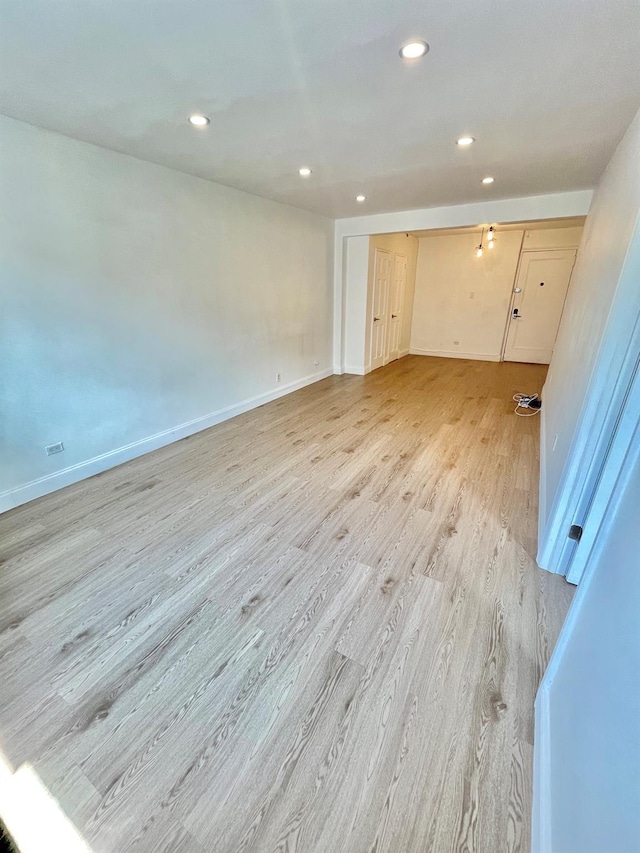 8385 116th St Unit 4B, Kew Gardens, NY 11418 - empty room with light wood finished floors and recessed lighting