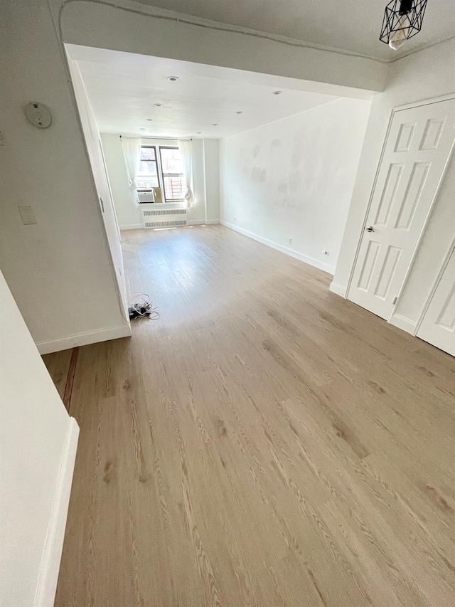 8385 116th St Unit 4B, Kew Gardens, NY 11418 - spare room featuring light wood-style floors and baseboards