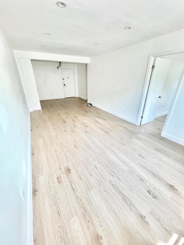 8385 116th St Unit 4B, Kew Gardens, NY 11418 - spare room featuring light wood-style flooring and baseboards