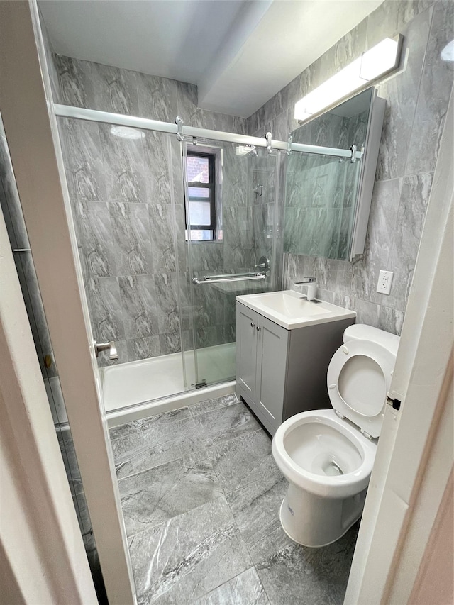 8385 116th St Unit 4B, Kew Gardens, NY 11418 - full bathroom with tile walls, a shower stall, and vanity