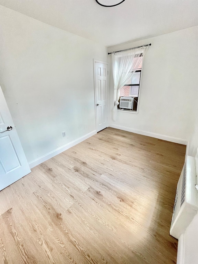 8385 116th St Unit 4B, Kew Gardens, NY 11418 - unfurnished room with wood finished floors and cooling unit
