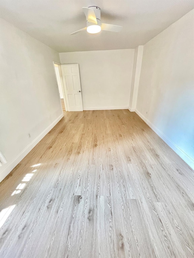 8385 116th St Unit 4B, Kew Gardens, NY 11418 - empty room with light wood-style floors and ceiling fan