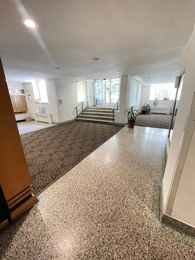 8385 116th St Unit 4B, Kew Gardens, NY 11418 - interior space with stairs, recessed lighting, speckled floor, and a baseboard radiator