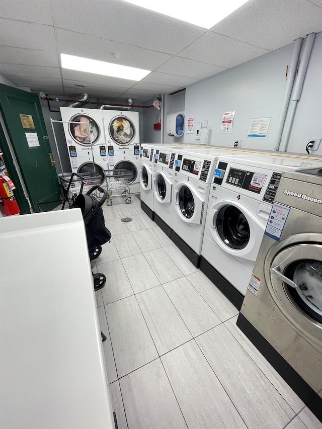 8385 116th St Unit 4B, Kew Gardens, NY 11418 - community laundry room featuring stacked washer / drying machine, independent washer and dryer, and light tile patterned floors