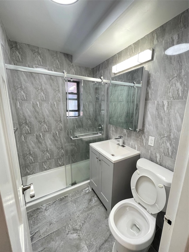 8385 116th St Unit 4B, Kew Gardens, NY 11418 - bathroom with vanity, a shower stall, and tile walls