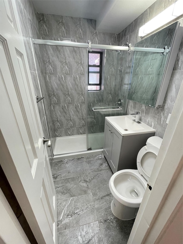8385 116th St Unit 4B, Kew Gardens, NY 11418 - full bath featuring a shower stall, vanity, and tile walls
