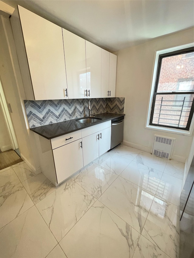8385 116th St Unit 4B, Kew Gardens, NY 11418 - kitchen featuring stainless steel dishwasher, dark countertops, light marble finish flooring, and backsplash