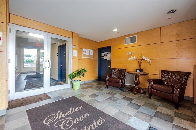 600 Clarence Ave Unit 1J, Bronx, NY 10465 - building lobby with wood walls and recessed lighting