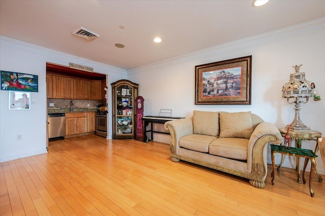 600 Clarence Ave Unit 1J, Bronx, NY 10465 - living room featuring ornamental molding, light wood-style floors, and recessed lighting