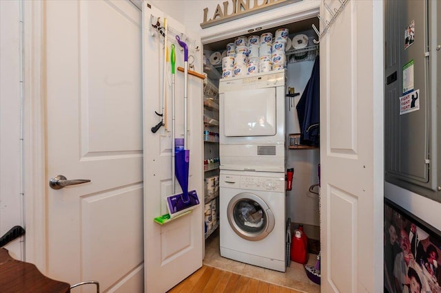 600 Clarence Ave Unit 1J, Bronx, NY 10465 - laundry area with stacked washer / dryer and light wood finished floors