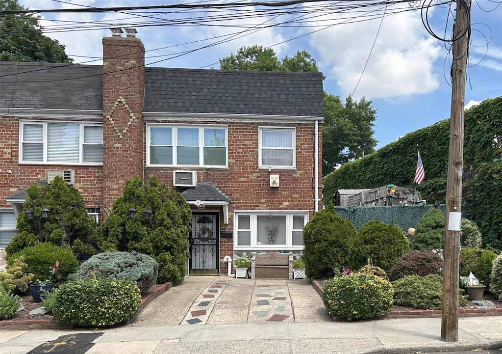 60-23 60th Rd, Maspeth, NY 11378 - multi unit property with brick siding, a chimney, and roof with shingles