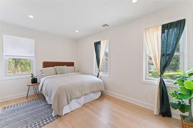 1 Saunders St, Hastings-On-Hudson, NY 10706 - bedroom featuring multiple windows, light wood-type flooring, and recessed lighting