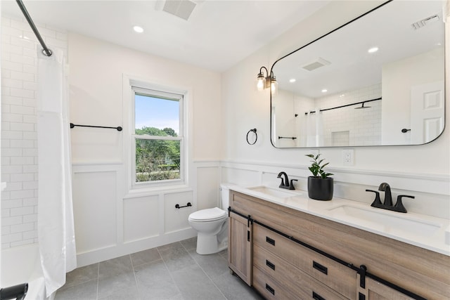 1 Saunders St, Hastings-On-Hudson, NY 10706 - full bath with double vanity, tile patterned floors, wainscoting, shower / bath combination with curtain, and recessed lighting