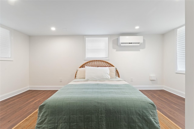 1 Saunders St, Hastings-On-Hudson, NY 10706 - bedroom with an AC wall unit, dark wood finished floors, and recessed lighting