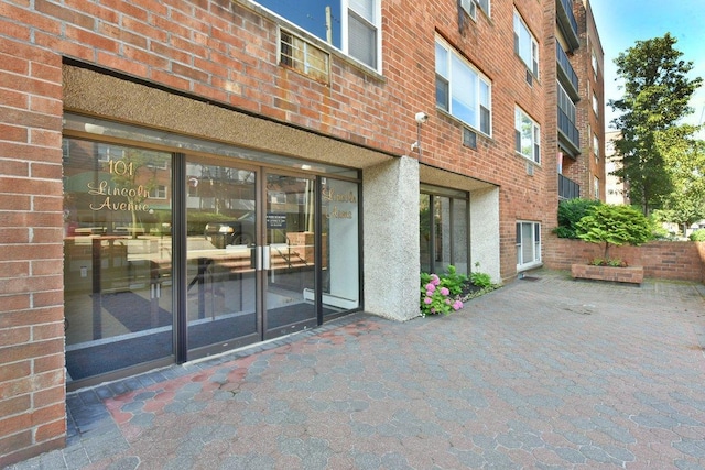 101 Lincoln Ave Unit 3K, Mineola, NY 11501 - entrance to property with brick siding and a patio