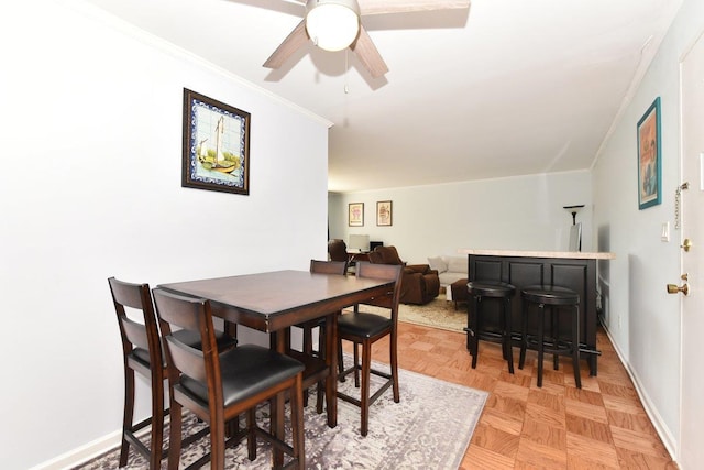 101 Lincoln Ave Unit 3K, Mineola, NY 11501 - dining room featuring crown molding and a ceiling fan
