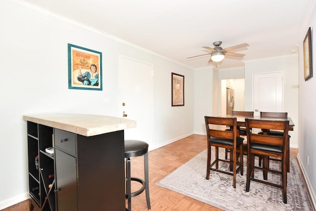 101 Lincoln Ave Unit 3K, Mineola, NY 11501 - dining area with a ceiling fan and crown molding