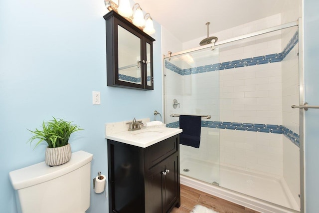 101 Lincoln Ave Unit 3K, Mineola, NY 11501 - bathroom featuring a shower stall, vanity, and wood finished floors