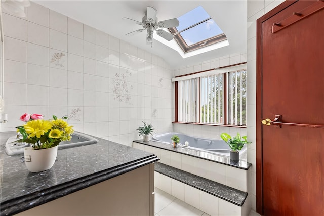 154-70 11th Ave, Beechhurst, NY 11357 - bathroom featuring tile walls, a skylight, a garden tub, ceiling fan, and vanity