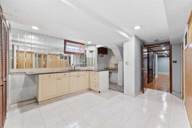 154-70 11th Ave, Beechhurst, NY 11357 - kitchen with cream cabinetry, arched walkways, and recessed lighting