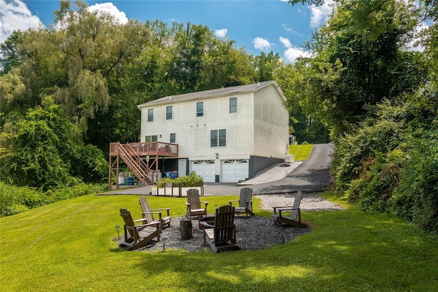 7 Glen Ct, Pawling, NY 12564 - rear view of property with stairway, a garage, an outdoor fire pit, a wooden deck, and a lawn